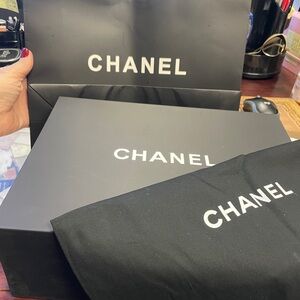 CHANEL Black Luxury Box, dust cover, and shopping bag.
